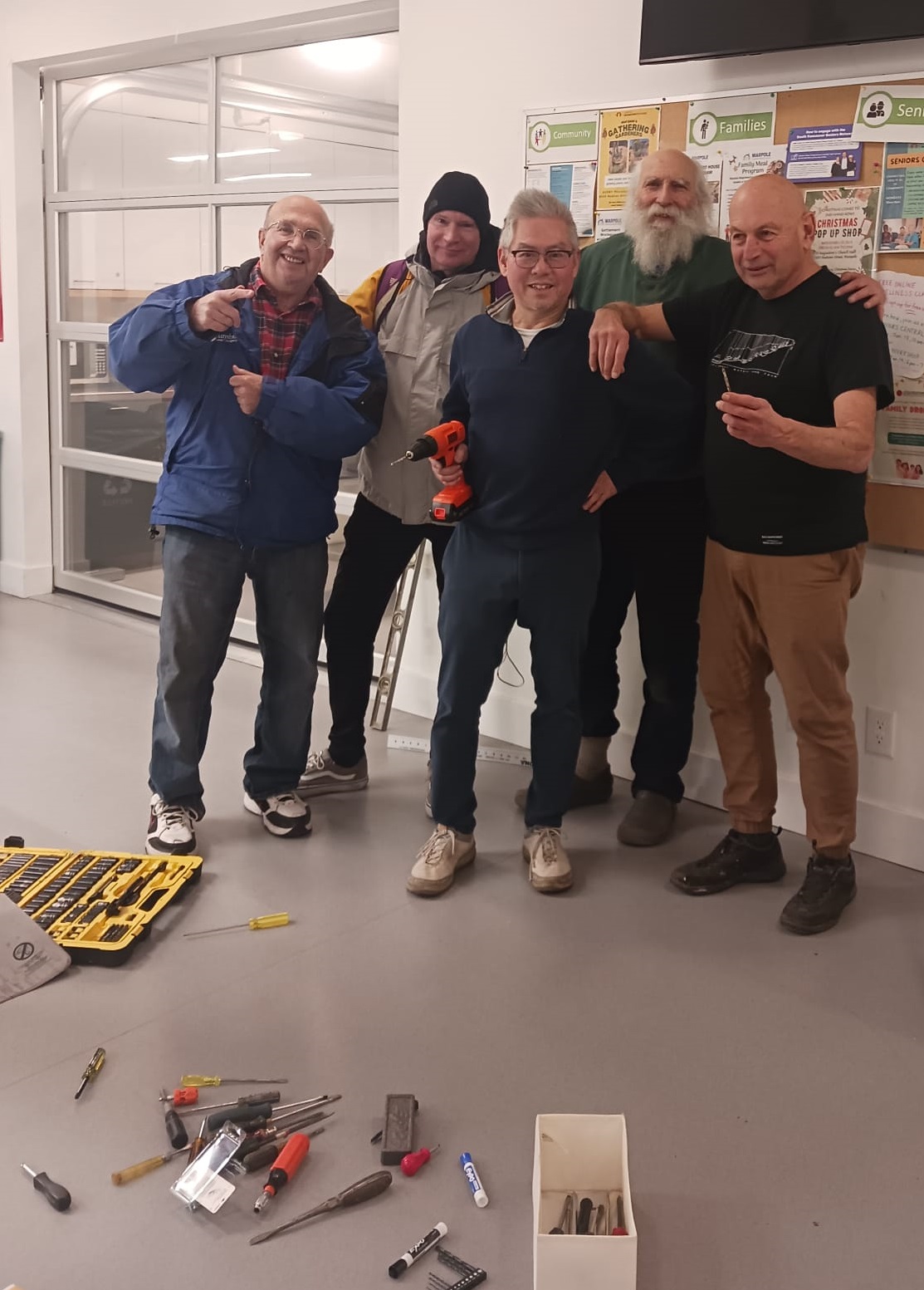 Installing the Bulletin Board at Marpole Neighbourhood House